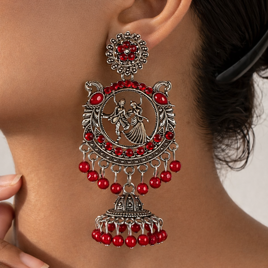 Radha Krishna Oxidised Silver Jhumka Earrings with Red Beads